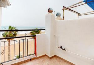 a balcony with a view of the beach at Ibicenco Villajoyosa in Villajoyosa