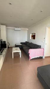 a living room with a couch and a table at Premium Luxury Residence RITS in Salou +27 photos