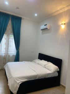 Giường trong phòng chung tại Preshome