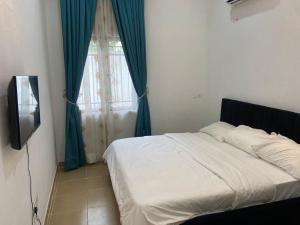 Giường trong phòng chung tại Preshome