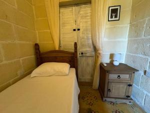 Postel nebo postele na pokoji v ubytování Ta Speranza Farmhouse B&B