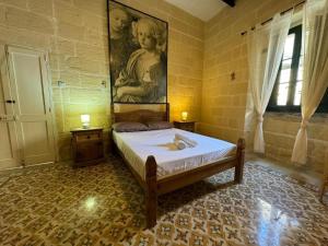 Postel nebo postele na pokoji v ubytování Ta Speranza Farmhouse B&B