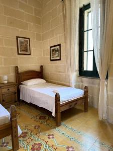 Postel nebo postele na pokoji v ubytování Ta Speranza Farmhouse B&B