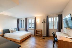 Ένα ή περισσότερα κρεβάτια σε δωμάτιο στο Hotel Le Lion - Self Check-in