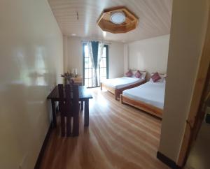 Postel nebo postele na pokoji v ubytování Quarry Bay Hometel Sagada
