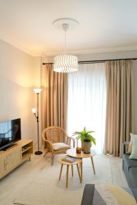 TV a/nebo společenská místnost v ubytování Freya Apartments