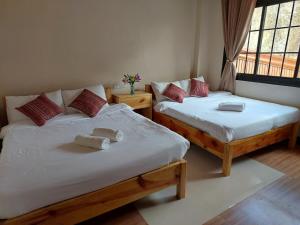 Postel nebo postele na pokoji v ubytování Quarry Bay Hometel Sagada