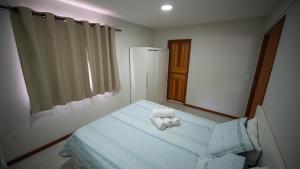 En eller flere senge i et værelse på Apartbuzios - Apartamentos Completos Búzios - 600mt Rua das Pedras