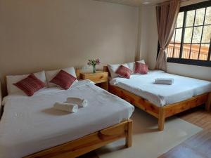 Postel nebo postele na pokoji v ubytování Quarry Bay Hometel Sagada