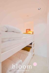 a white bunk bed in a white room at Le Saint Georges Nancy Stanislas in Nancy +6 photos