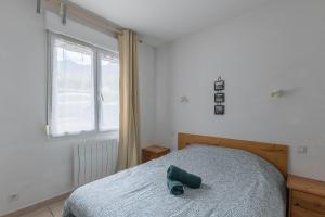 Postel nebo postele na pokoji v ubytování Le Cairn du Morgon - Appt vue montagne 4p
