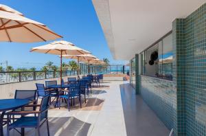 Balkón nebo terasa v ubytování Frente Mar Incrível - Acorde com o Som das Ondas!