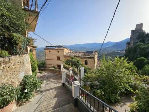 a stairway leading up to a house on a mountain at La Mocha Casa Rural - La Casa de María in La Iruela