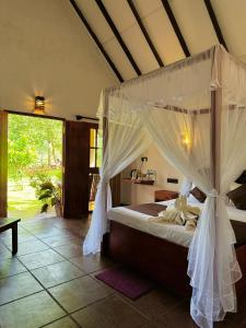 Postel nebo postele na pokoji v ubytování The Cottage Sigiriya