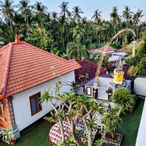 an aerial view of a resort with palm trees at Villa Jepun Lovina in Lovina