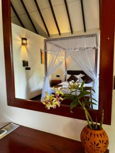 Letto o letti in una camera di The Cottage Sigiriya
