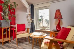 Χώρος καθιστικού στο Studio dans maison proche gare