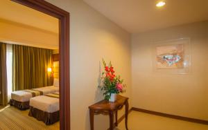 Postel nebo postele na pokoji v ubytování Pearl View Hotel Prai, Penang