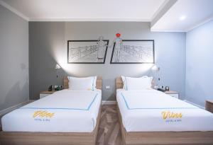 Vibes Hotel and Spa客房内的一张或多张床位