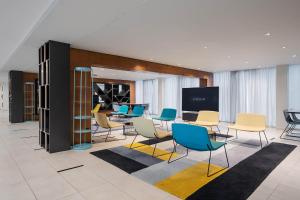 a room with chairs and a table and a screen at Eurostars Queen of Montenegro in Budva