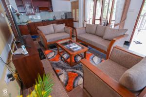 Posezení v ubytování Rivershore Villas