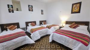 Postel nebo postele na pokoji v ubytování Mallku Wasi - Lodging Hotel Cusco