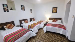 Postel nebo postele na pokoji v ubytování Mallku Wasi - Lodging Hotel Cusco