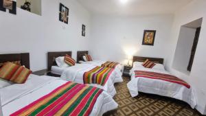 Postel nebo postele na pokoji v ubytování Mallku Wasi - Lodging Hotel Cusco