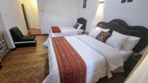 Postel nebo postele na pokoji v ubytování Mallku Wasi - Lodging Hotel Cusco