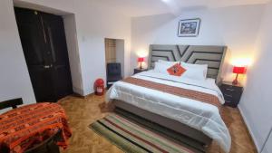 Postel nebo postele na pokoji v ubytování Mallku Wasi - Lodging Hotel Cusco
