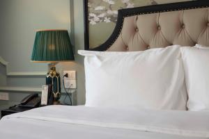 Postel nebo postele na pokoji v ubytování Madelise Amica Hotel and Travel