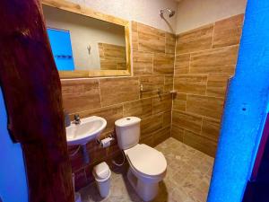 a bathroom with a toilet and a sink at Roma beach in Cartagena de Indias