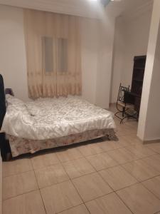 Ένα ή περισσότερα κρεβάτια σε δωμάτιο στο Appartement Catherine BM