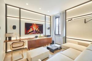 a living room with a couch and a table at Easylife - Milano - Tadino 13 - Porta Venezia in Milan