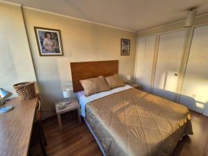 Ένα ή περισσότερα κρεβάτια σε δωμάτιο στο Apartamento Del Río +5 φωτογραφίες