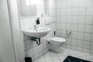 Koupelna v ubytování Sunnybelle Appartements Medingen + 12 fotografií