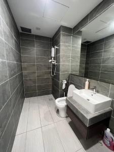 a bathroom with a sink and a toilet at BELLSUITE SEPANG NEAR KLIA Airport in Sepang