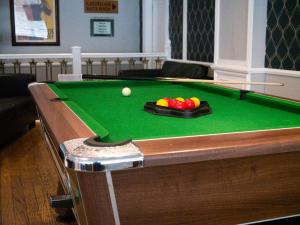 a pool table with a ball on top of it at Britannia Hotel Newcastle Airport in Newcastle upon Tyne