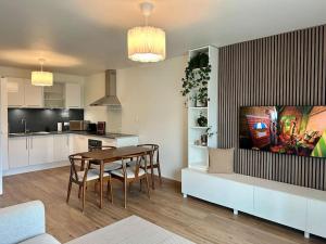Kuchyň nebo kuchyňský kout v ubytování Suite Alya Appartement proche Disneyland