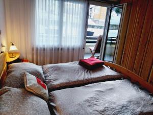Postel nebo postele na pokoji v ubytování Sky Haus Residence