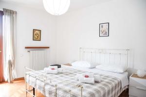 Postel nebo postele na pokoji v ubytování Appartamento Magnolia