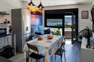 Η κουζίνα ή μικρή κουζίνα στο Ático Vistamar, con vistas a la Ría de Vigo +11 φωτογραφίες