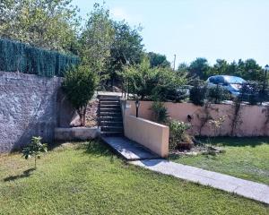 a set of stairs in a yard next to a fence at I Registi in Scalea