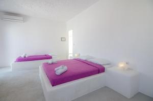 Postel nebo postele na pokoji v ubytování Sunrise Hotel