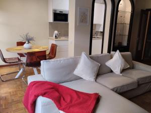 a living room with a couch and a table at Duplex Arriondas in Arriondas