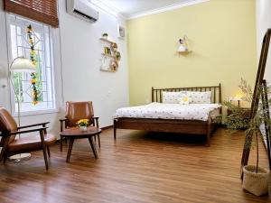 Ein Bett oder Betten in einem Zimmer der Unterkunft Mô Tê Homestay 2 gần Chợ Đông Ba, Cung Đình Hoàng Thành Huế