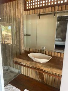 a bathroom with a sink and a mirror at Positano Village in Canoa Quebrada +20 photos