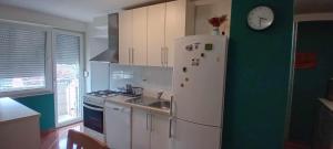 Kuchyň nebo kuchyňský kout v ubytování Apartman TIN