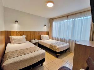 Postel nebo postele na pokoji v ubytování Hotel Intillanka