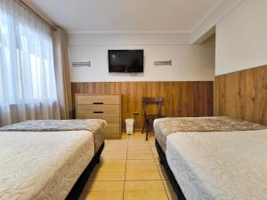 Postel nebo postele na pokoji v ubytování Hotel Intillanka